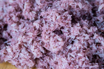 Close Up Riceberry Rice on wood Background, Product of thailand.