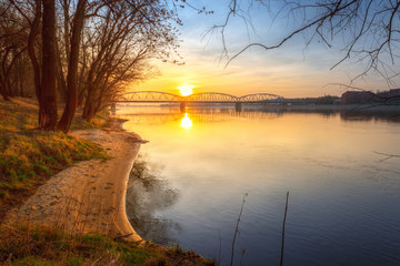 Amazing sunset over Vistula river in Torun, Poland