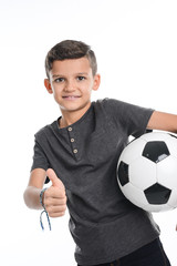 portrait of a young boy kid studio shot on white background with soccer football ball