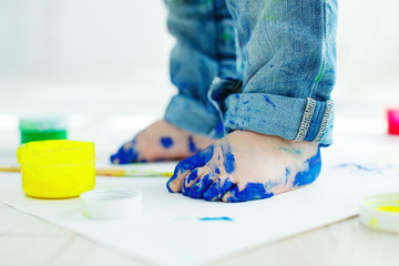 Little baby feet in paint