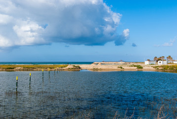 Poles in a flooded parking at the beach in Tyre, Lebanon