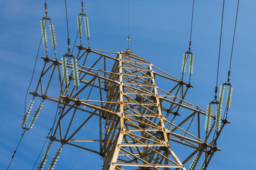 Electric pole with wires of high voltage against the sky.