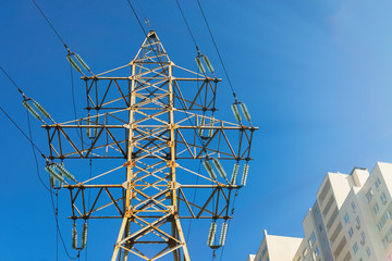Electric pole with wires of high voltage against the sky.