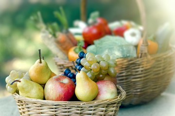 Fresh and healthy food in wicker basket - organic fruit and vegetable