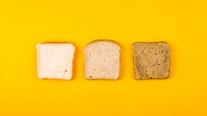 A selection of toast bread for breakfast. Minimalism on yellow