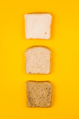 A selection of toast bread for breakfast. Minimalism on yellow