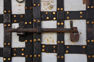 Old church door closed, rusty lock