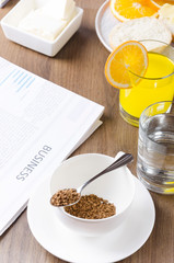 Vertical shot. Morning starts with coffee and fresh newspaper.Concept of morning breakfast