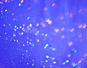 Blue background of shining drops of water