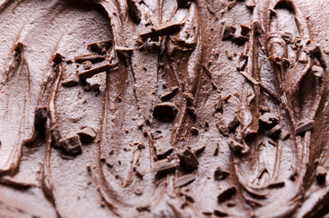 Closeup of chocolate pudding and chocolate chips on top of it.Chocolate sweet background
