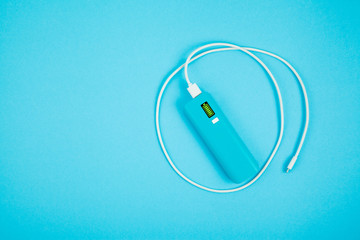 Power bank on color background