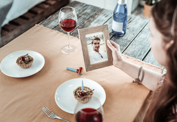 Woman feeling alone celebrating her birthday remotely