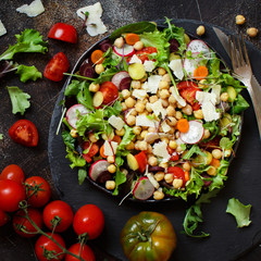 Chickpea salad with vegetables and microgreens