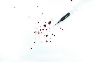 syringe with drop blood