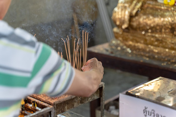 Man Praying for Buddha with Burning Incense