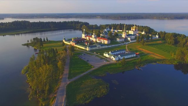 Top view from drone to Valdai Iversky Svyatoozersky Virgin Monastery for Men. Selvitsky Island, Valdai Lake. Bird's-eye view on summer evening
