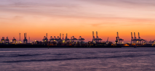 Fototapeta premium Panorama of container port in Hamburg, Germany at night