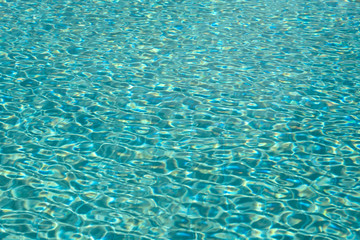 Clear water in swimming pool on sunny day