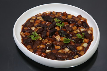 beef stew with vegetables and mushrooms in bowl