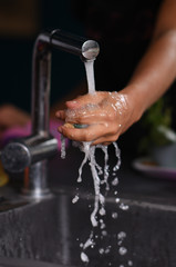 wash the dishes by hand