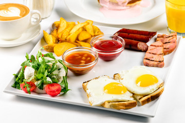 breakfast with egg, bacon, potatoes and salad