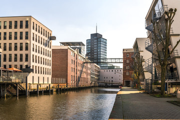 Urban development in the Harburg inland port. Old converted warehouses and new office buildings in the harbour. The city and the district are part of the federal state of Hamburg