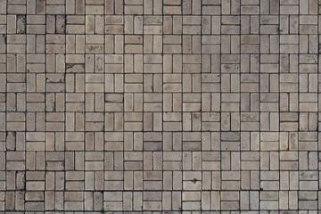 Gray paving stones with square pattern. Pedestrian road, pavement or sidewalk. Road background