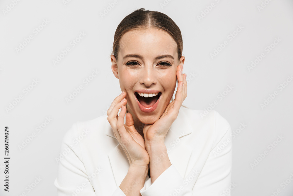 Sticker Photo of charming businesswoman 20s wearing elegant jacket screaming and rejoicing at camera