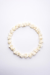Jasminum sambac or Mogra Flower arranged in a  circular or rectangular  frame shape over white background, selective focus