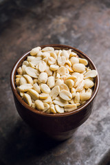 Roasted and salted peanut in bowl. Selective focus. Shallow depth of field.