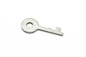 Simple metallic key on white background