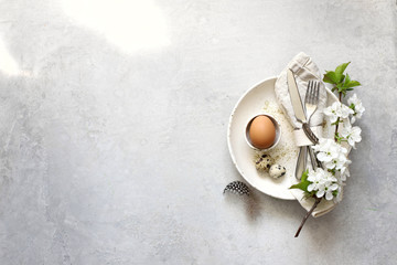 Table setting for happy Easter in rustic style.