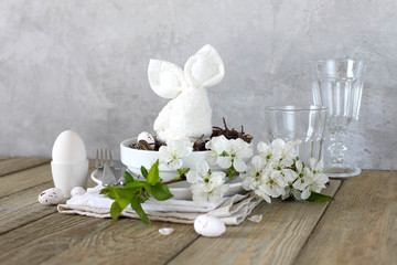 Table setting for happy Easter in rustic style.