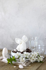 Table setting for happy Easter in rustic style.