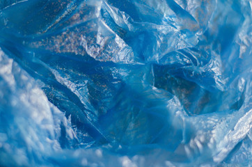 blue plastic bag texture with glitter on it with bokeh effect