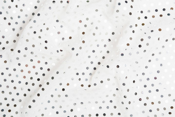 Glamour metal glitter service. White fabric textile material with silver sequins background
