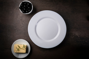Obraz na płótnie Canvas Table setting for a meal.White plate, 