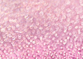 Pink background of shining drops of water