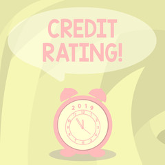 Word writing text Credit Rating. Business photo showcasing estimate of ability of demonstrating fulfil financial commitments Round Blank Speech Balloon in Pastel Shade and Colorful Analog Alarm Clock