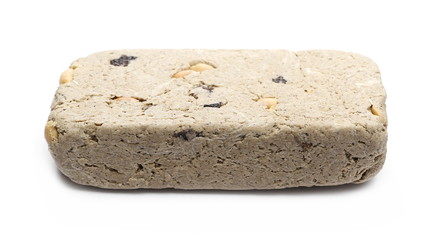 Halvah with raisins and peanuts isolated on white background