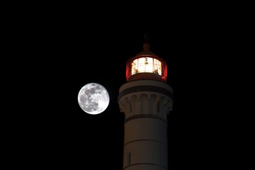 Super full moon with a lighthouse
