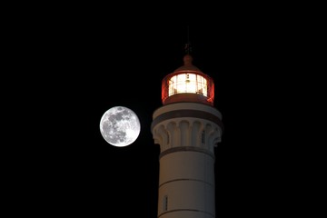 Super full moon with a lighthouse