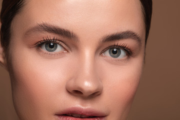 Woman with natural makeup having her eyes wide open