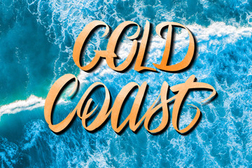 Gold Coast lettering over vivid blue crushing waves