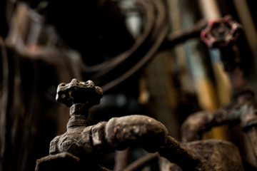 Old steel factory Retro photography Industrial, old factory, metal pipe, dark interior decoration of large hall for production or warehouse.soft focus.