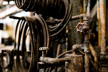 Old steel factory Retro photography Industrial, old factory, metal pipe, dark interior decoration of large hall for production or warehouse.soft focus.