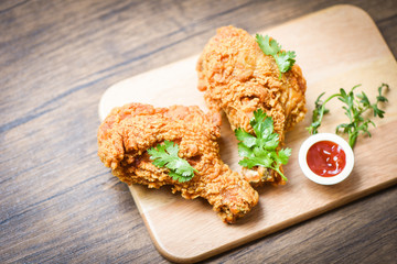 Fried chicken crispy on plate wooden board with ketchup on dining table food