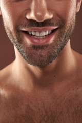 Obraz premium Low face portrait of happy young bristle man