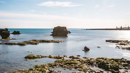 calm sea with summer rocks waiting for the good weather