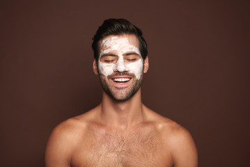 Happy smiling manful guy with face mask